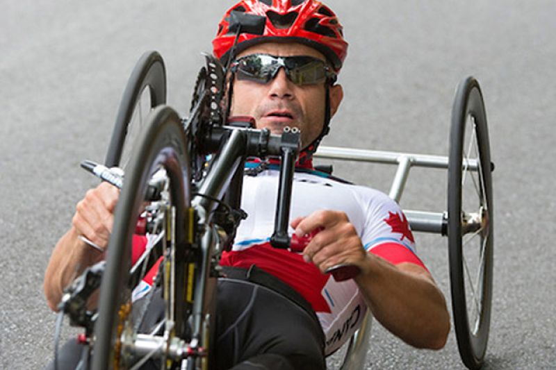 man racing in a handcycle